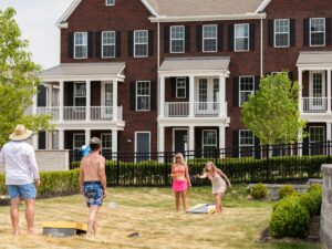 The beanbag toss sets the stage for a fun afternoon and a cold drink with friends.