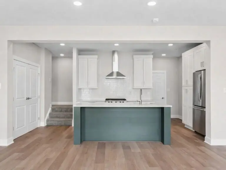 Modern kitchen with sage green island