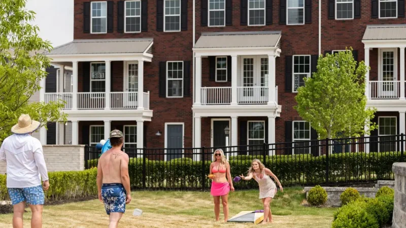 The beanbag toss sets the stage for a fun afternoon and a cold drink with friends.